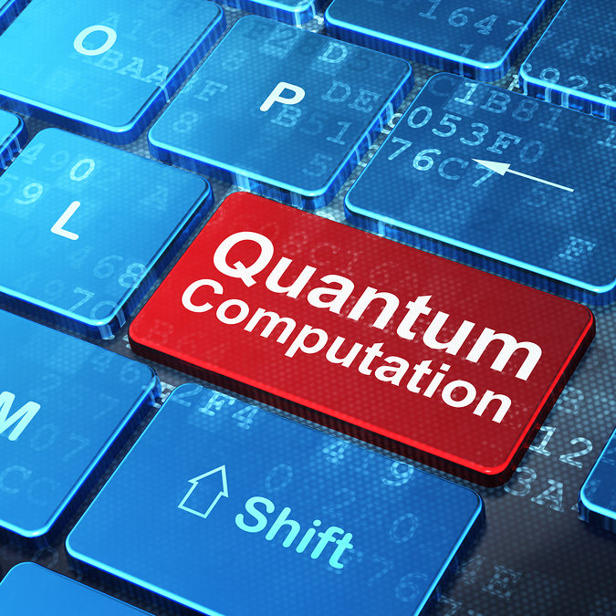 Science concept: Quantum Computation on computer keyboard backgr